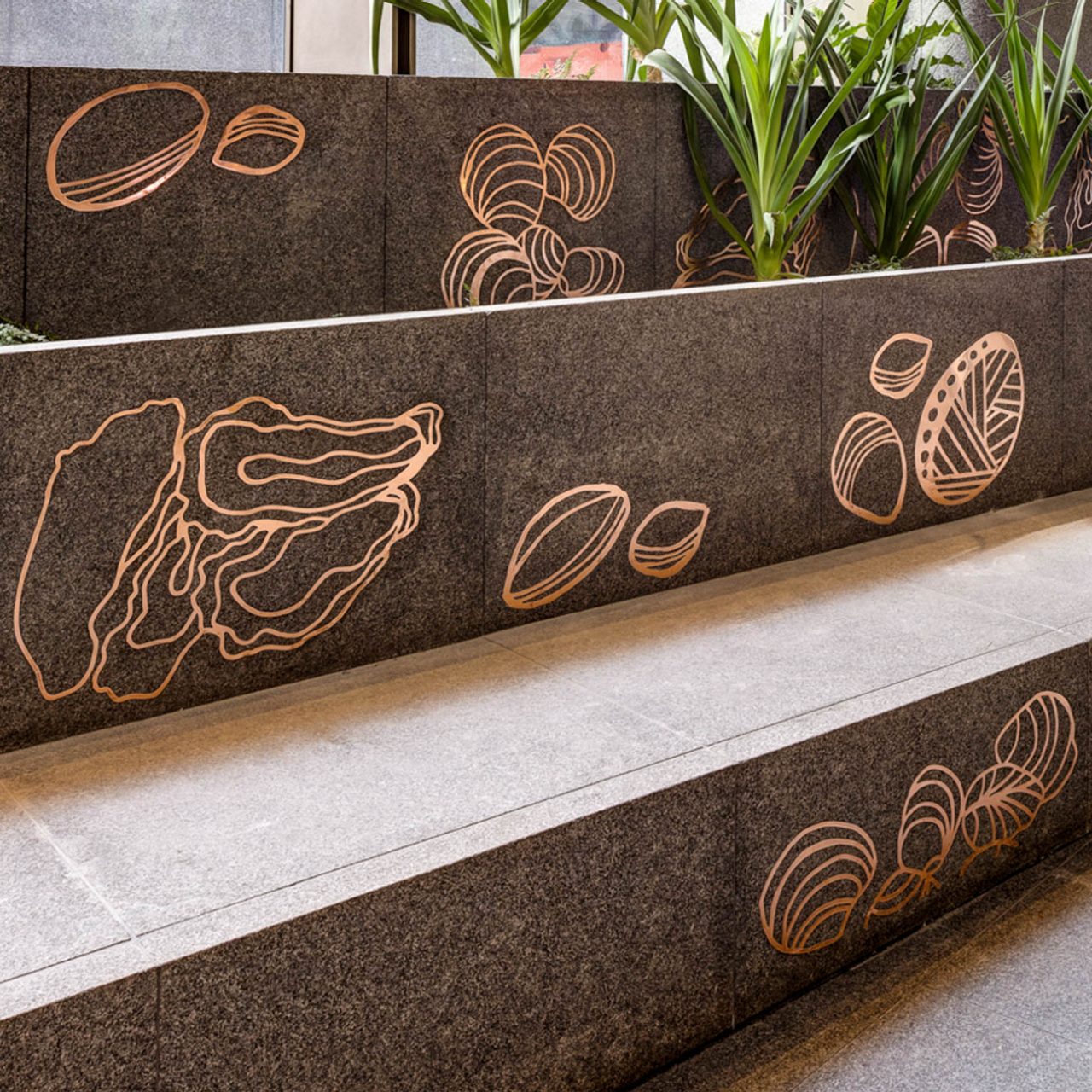 Nura & Garrigarrang copper inlays featured on public seating in 1 Elizabeth