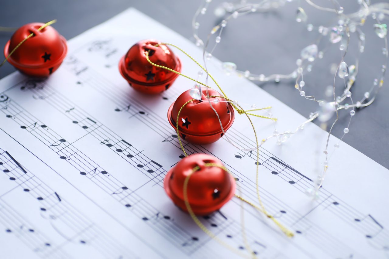 Christmas Sheet Music. Christmas decorations on music sheets, closeup

